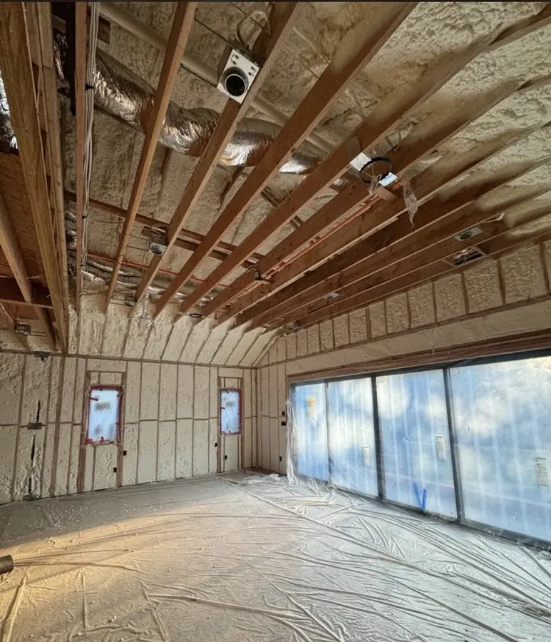 Interior walls and ceiling insulated with spray foam during new construction in Buckeye